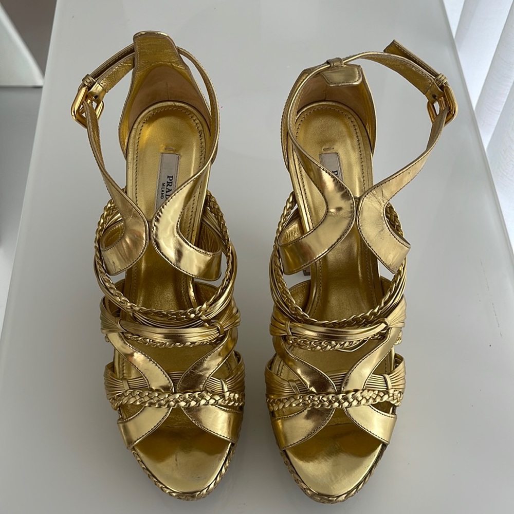 Prada gold platform heels. Braided and crossed over strap details.